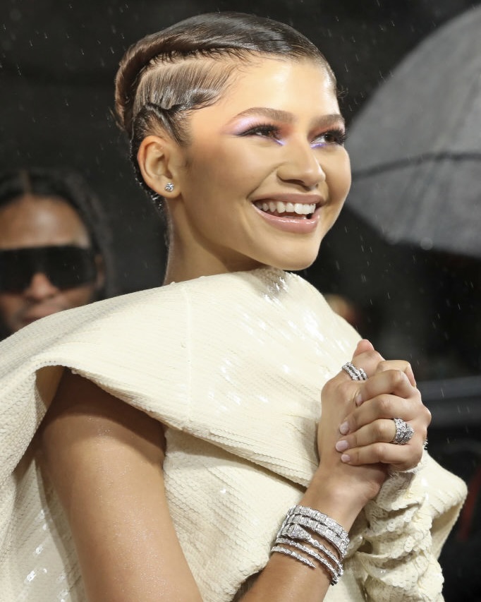 Snake Jewelry: Zendaya wears Bulgari Serpenti diamond cuff bracelets at the "Dune" UK premiere in 2021. 