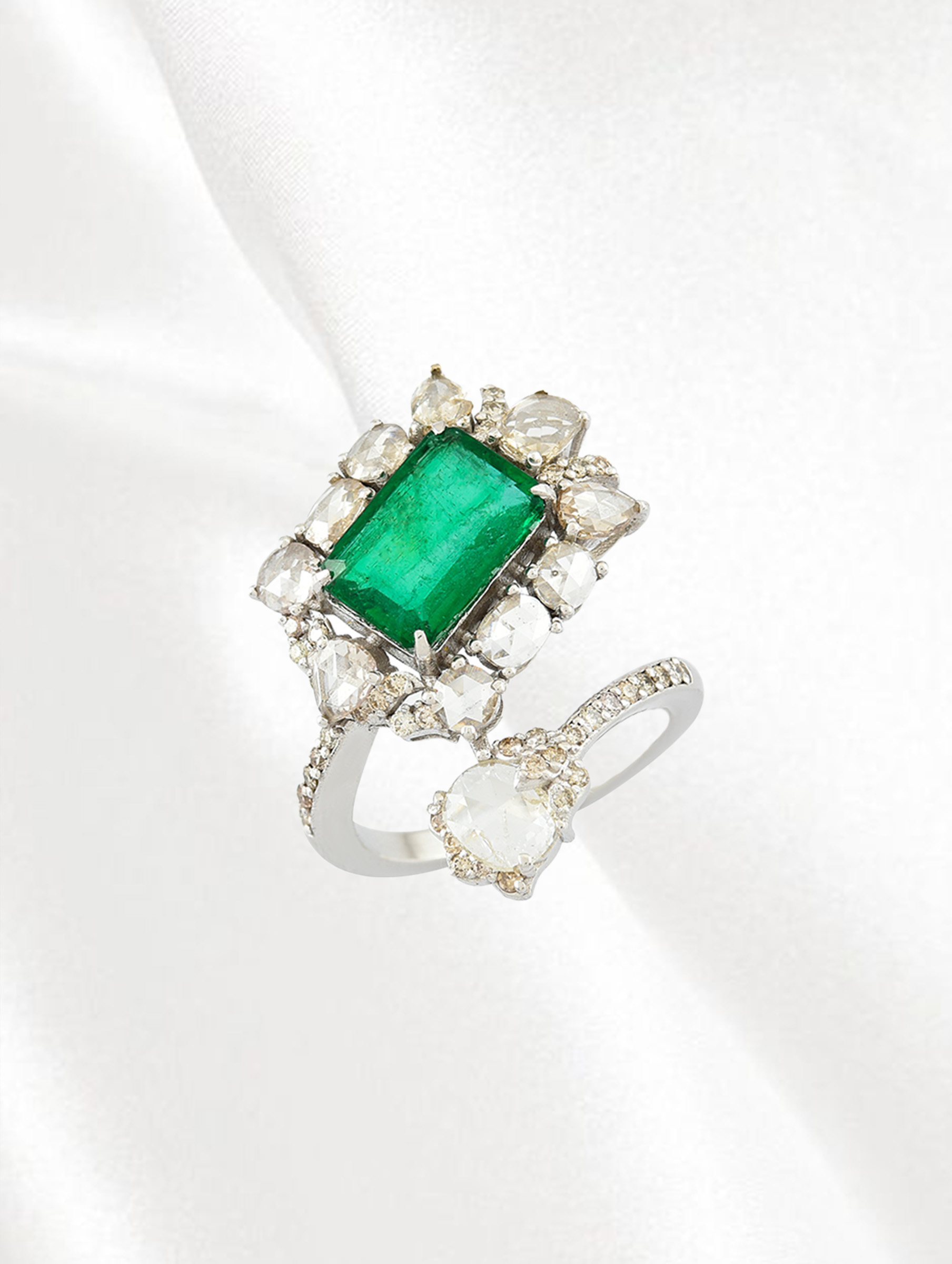 Emerald and diamond ring with a diamond-frosted band from Amrapali 