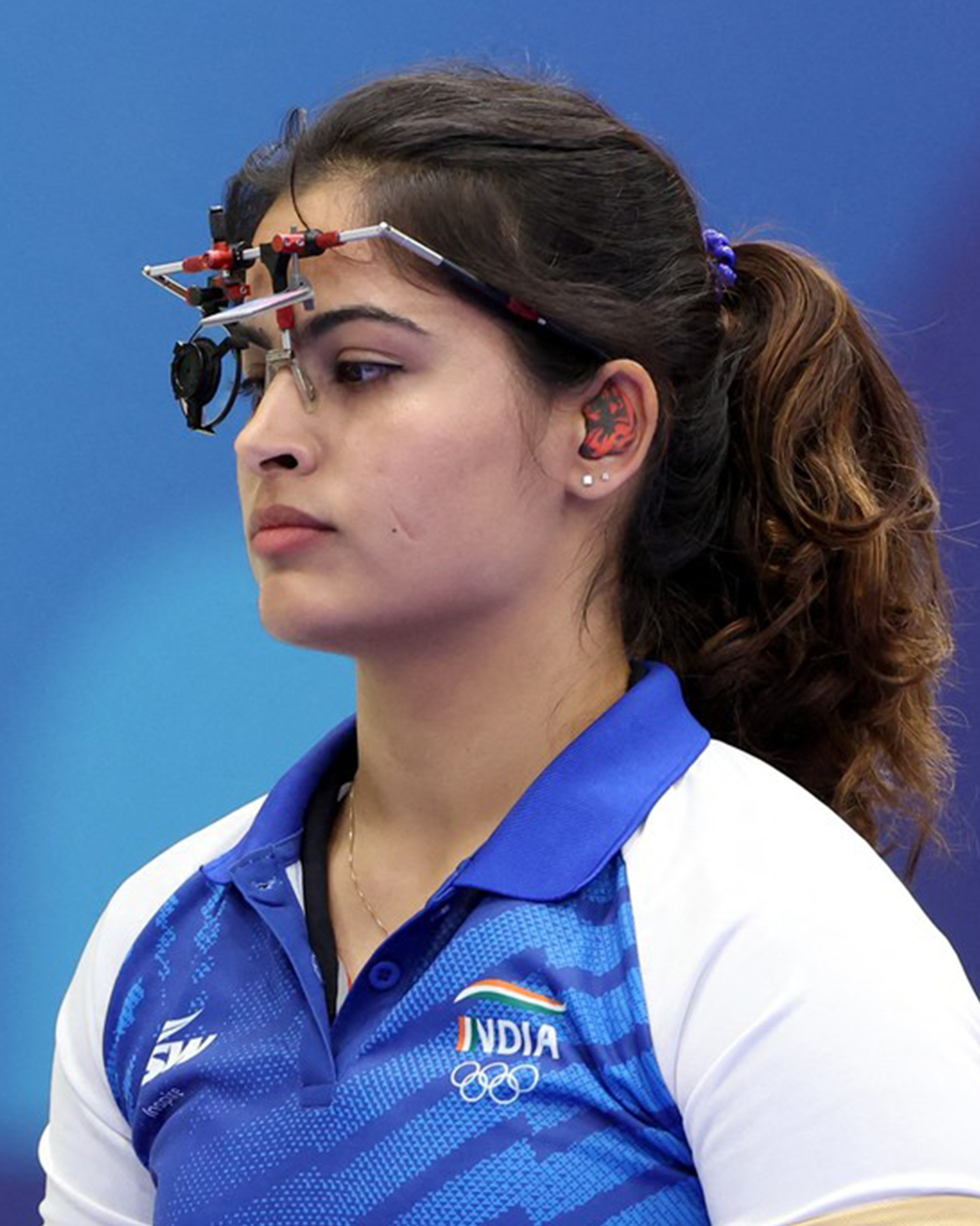 Manu Bhaker aiming in a shooting event at Paris Olympics 2024