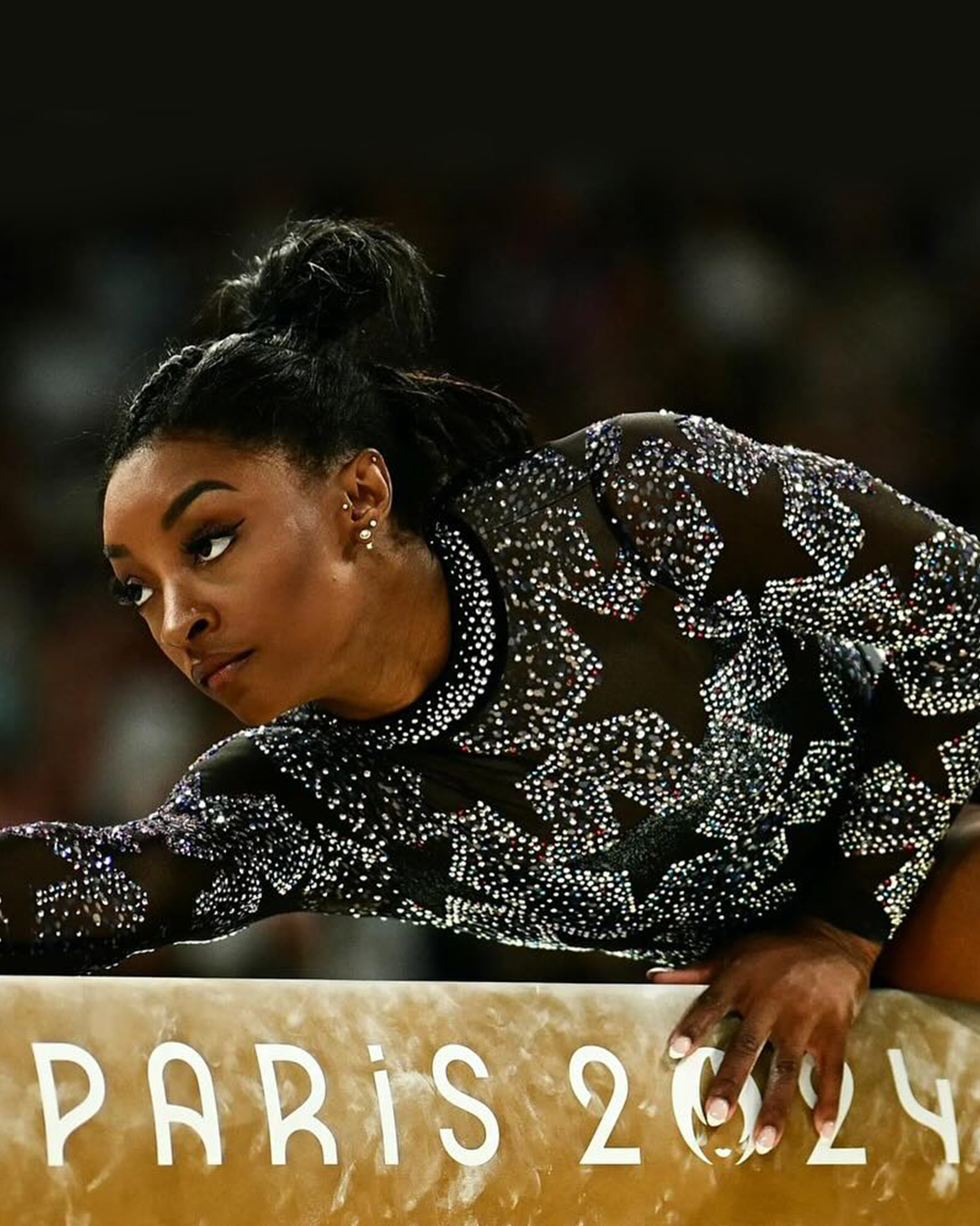 Simone Biles performing a gymnastics routine at Paris Olympics 2024