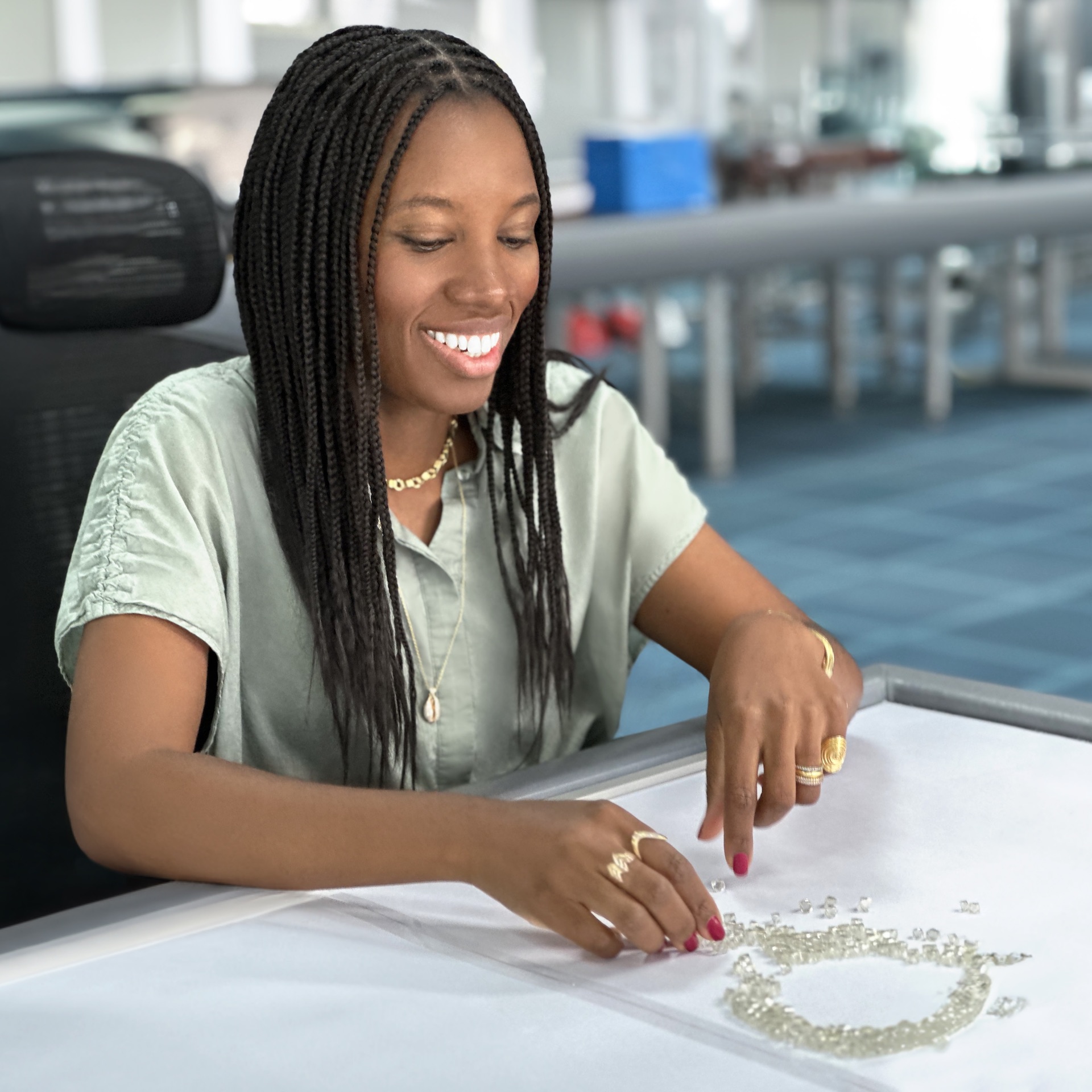 Almasika designer Catherine Sarr sorting diamonds