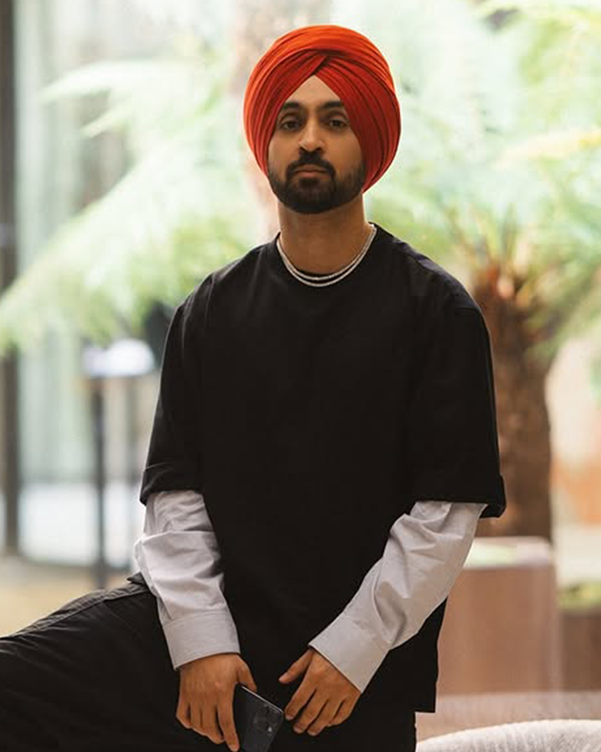 Diljit Dosanjh shines in a two-string diamond tennis necklace at Cartier Paris