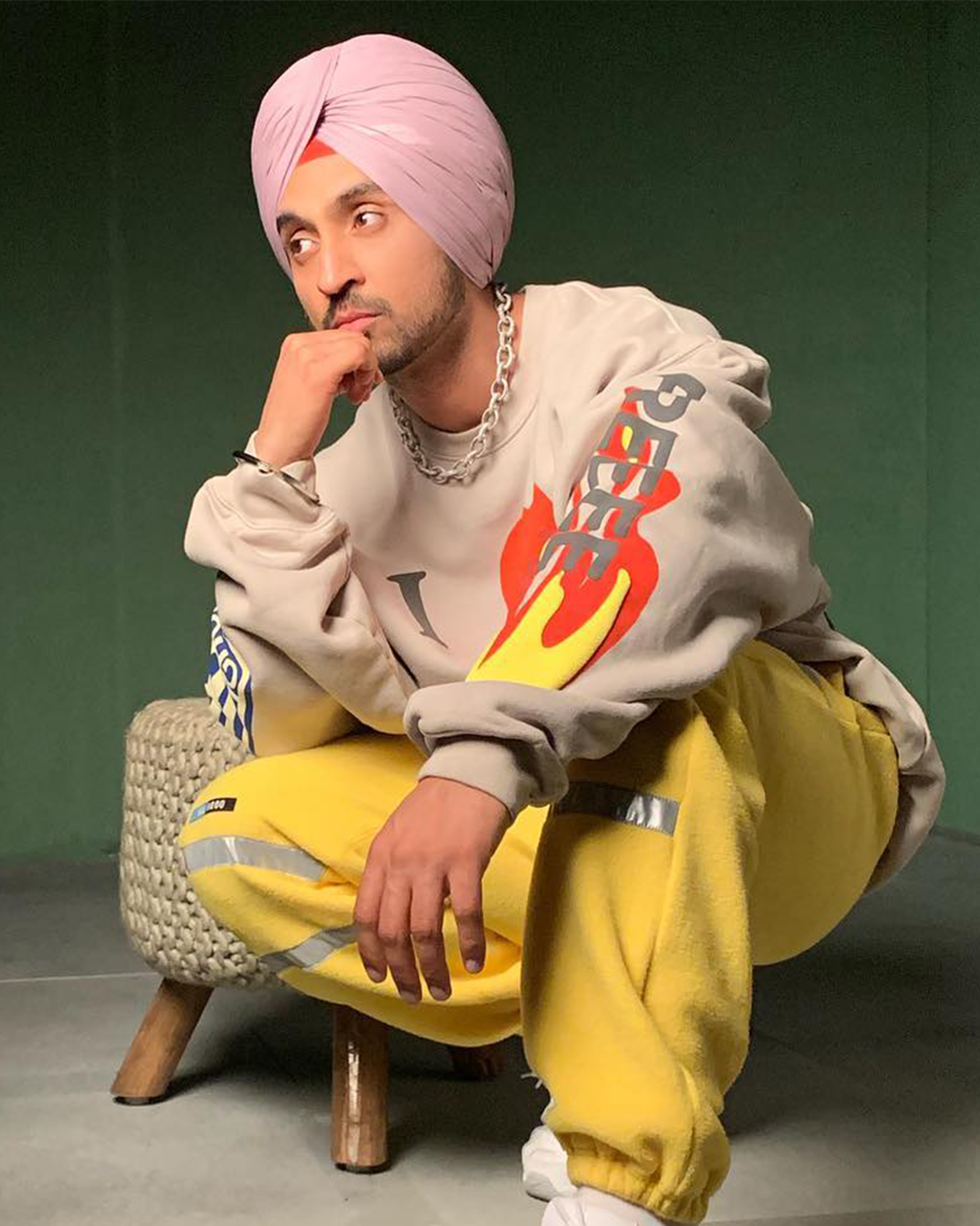 Diljit Dosanjh sporting a diamond link chain, proving minimalism can steal the show.