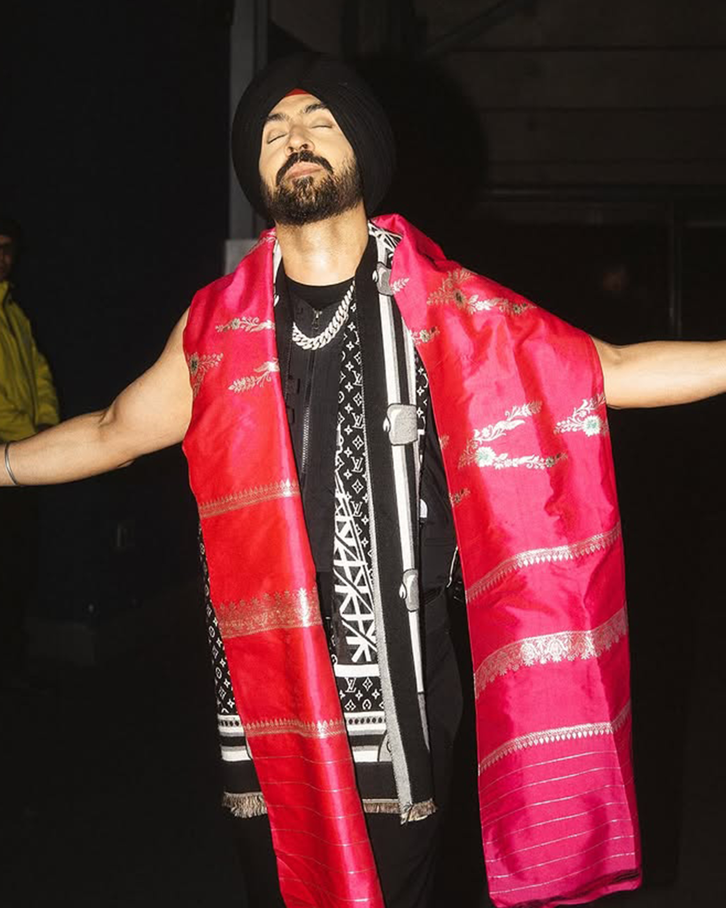 Diljit Dosanjh rocking a diamond-encrusted Cuban chain, blending royalty with hip-hop style