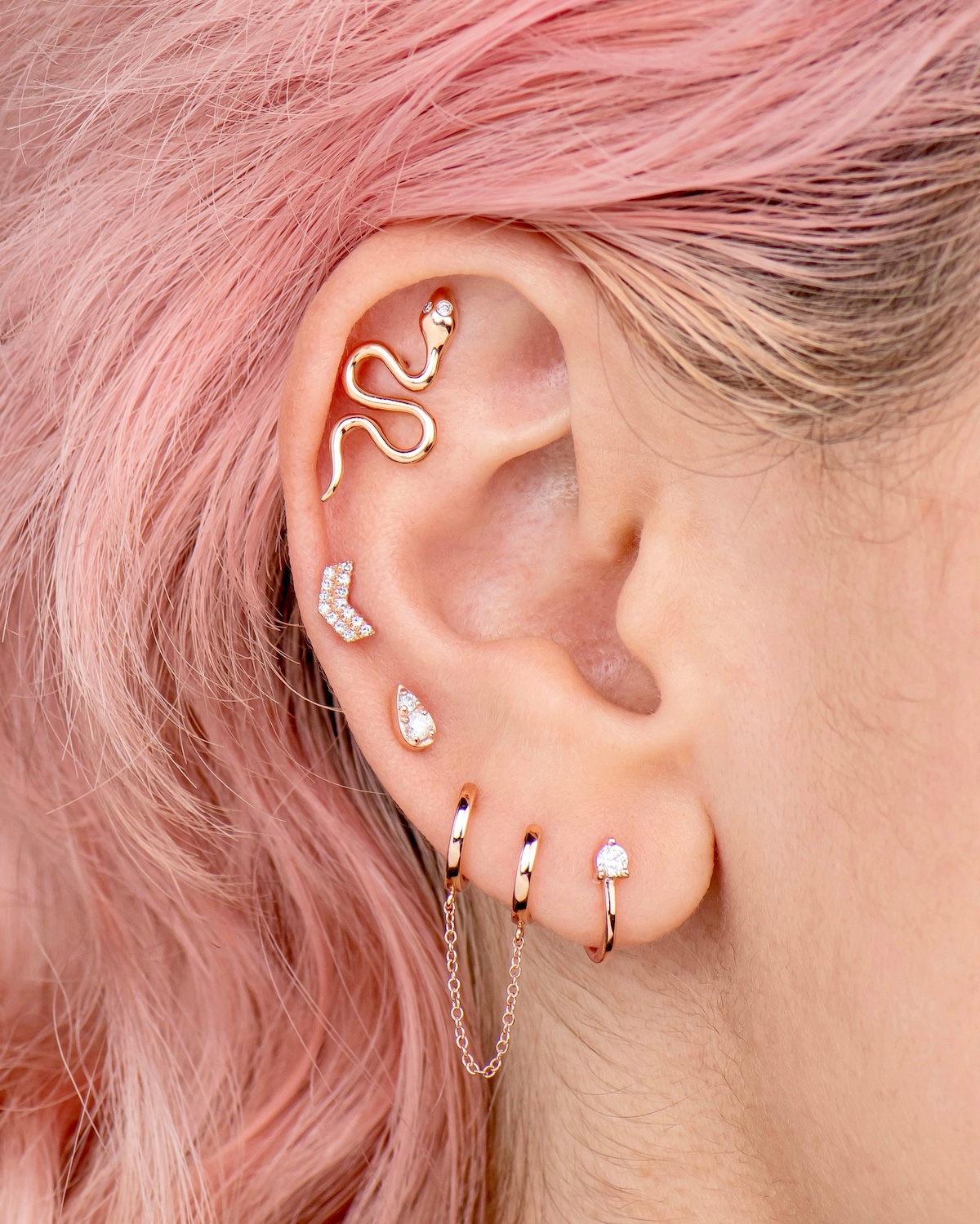 Ali Weiss Large Gold Snake Stud in cartilage piercing. Year of the Snake.